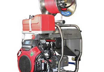 Drain technician clearing an outdoor line beside a house